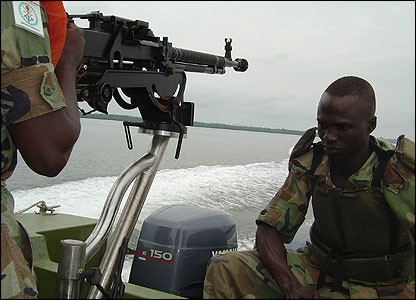 Army Amphibious troops patrol in a Scorpion Mk.II gunboat