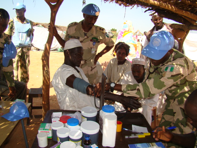 Nigerian peacekeepers care for the local population in Darfur, Sudan
